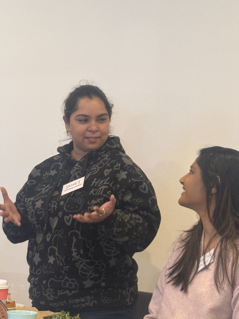 BGN Bundoora member speaking animatedly to another member