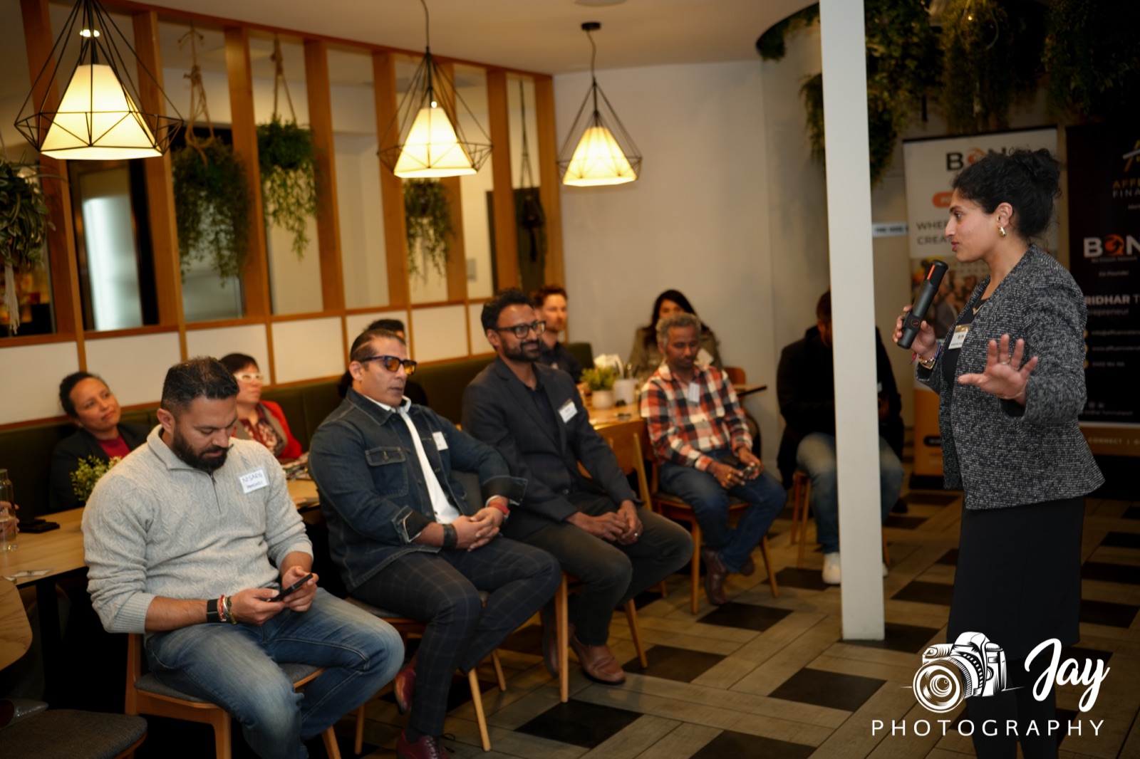 Wide view of the full room at a BGN Caulfield dinner, member speaking to the group