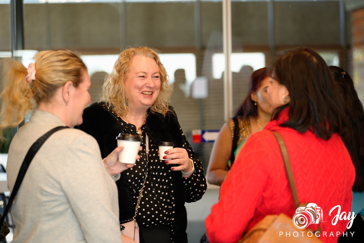 Two BGN Cranbourne members laughing over coffee