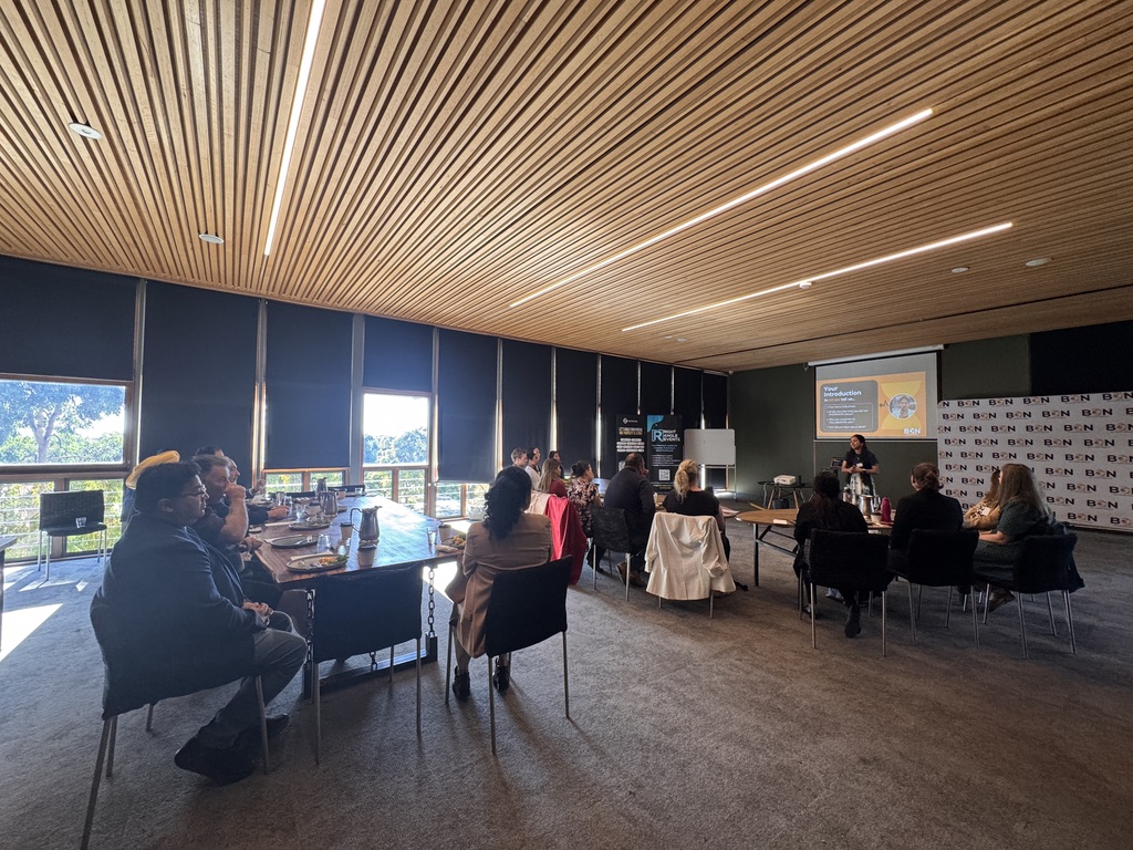 View across the room at a BGN Cranbourne breakfast, members seated at the long table