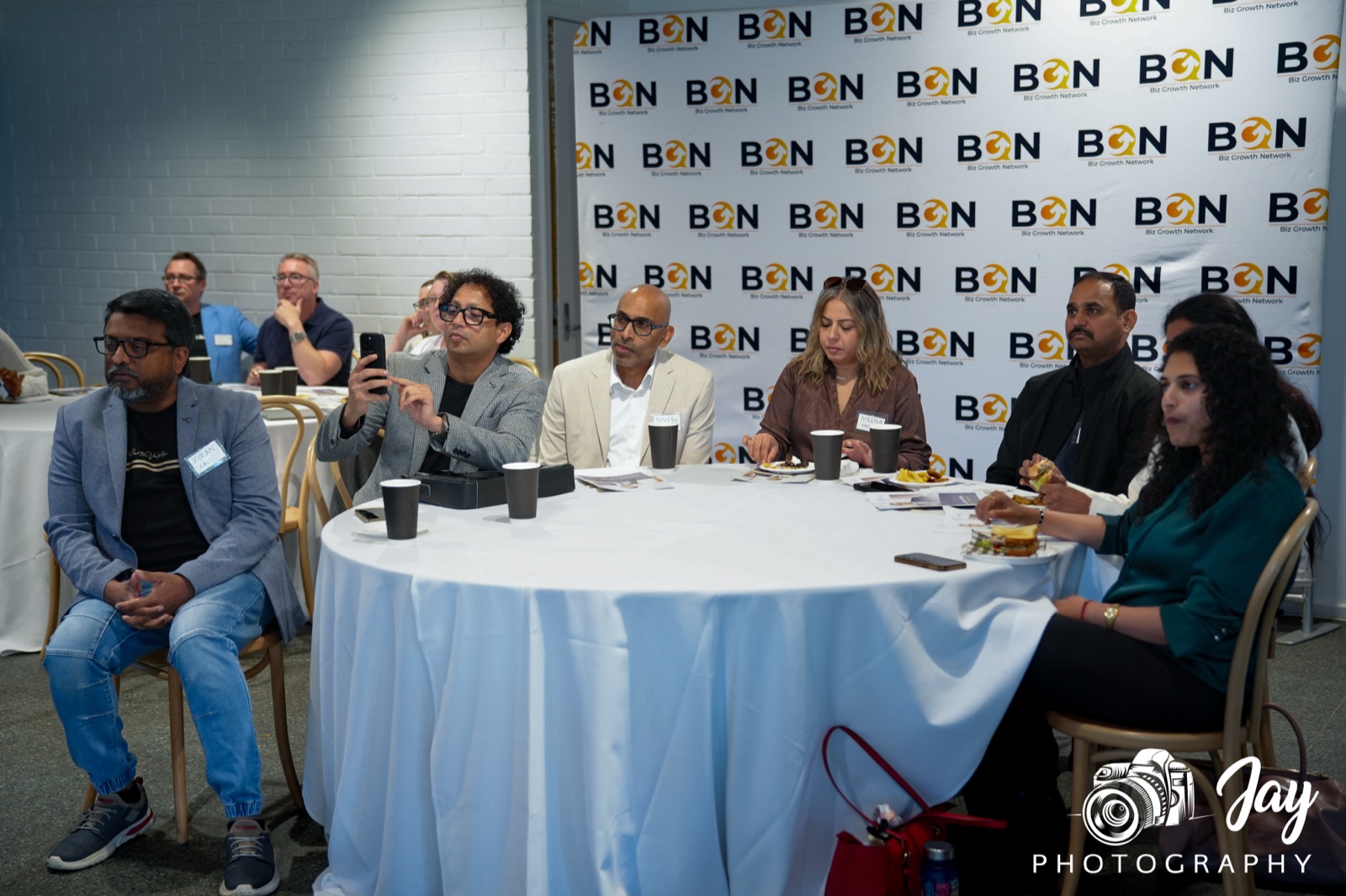 BGN Jells Park members gathered around the table, in conversation over lunch